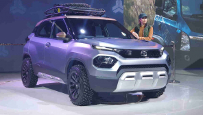 Young Model Standing Near The Porduct at the Auto Expo 2020