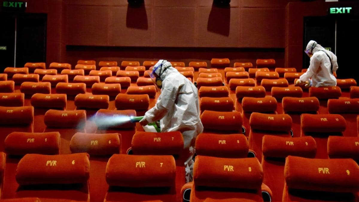 PVR Cinemas employees sanitizing the cinema hall