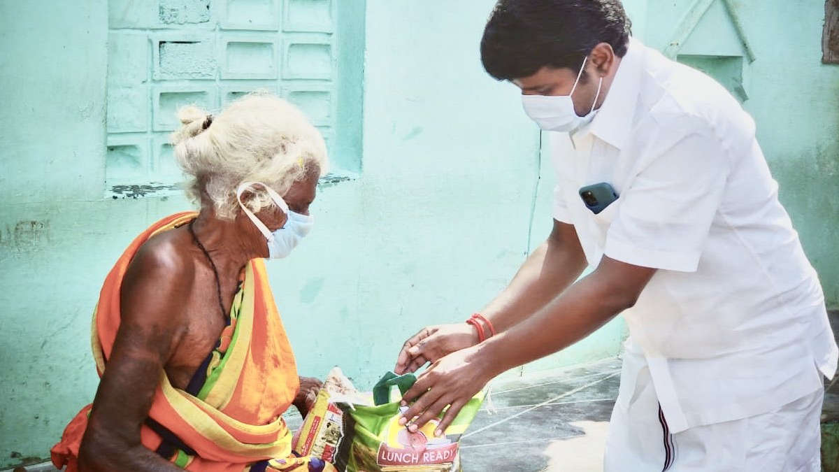 Health Minister C Vijayabaskar distributing rations to the needy people on World food day.