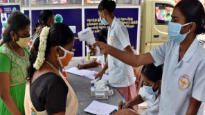 Health staff screening travellers at a coronavirus camp in Gandhipuram bus stand in Coimbatore. 